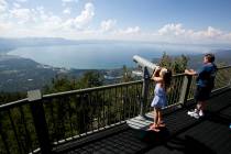 FILE - In this Aug. 8, 2017, file photo, Lilyana Allen, of Guam, uses a telescope to view Lake ...