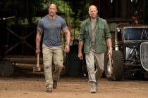 This image released by Universal Pictures shows Dwayne Johnson, left, and Jason Statham in a sc ...