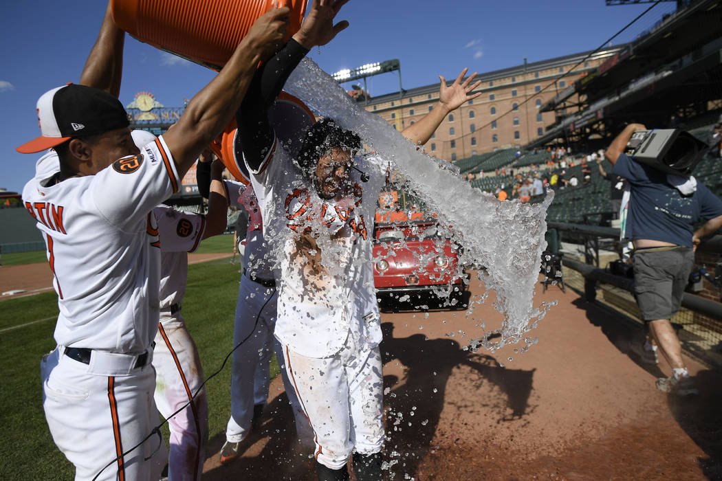 Baltimore Orioles' Rio Ruiz is doused after a baseball game against the Houston Astros, Sunday, ...