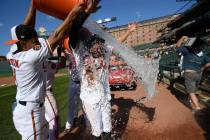 Baltimore Orioles' Rio Ruiz is doused after a baseball game against the Houston Astros, Sunday, ...