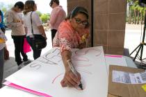 Richard Brian/Las Vegas Review-Journal A woman makes a sign before the start of a rally support ...