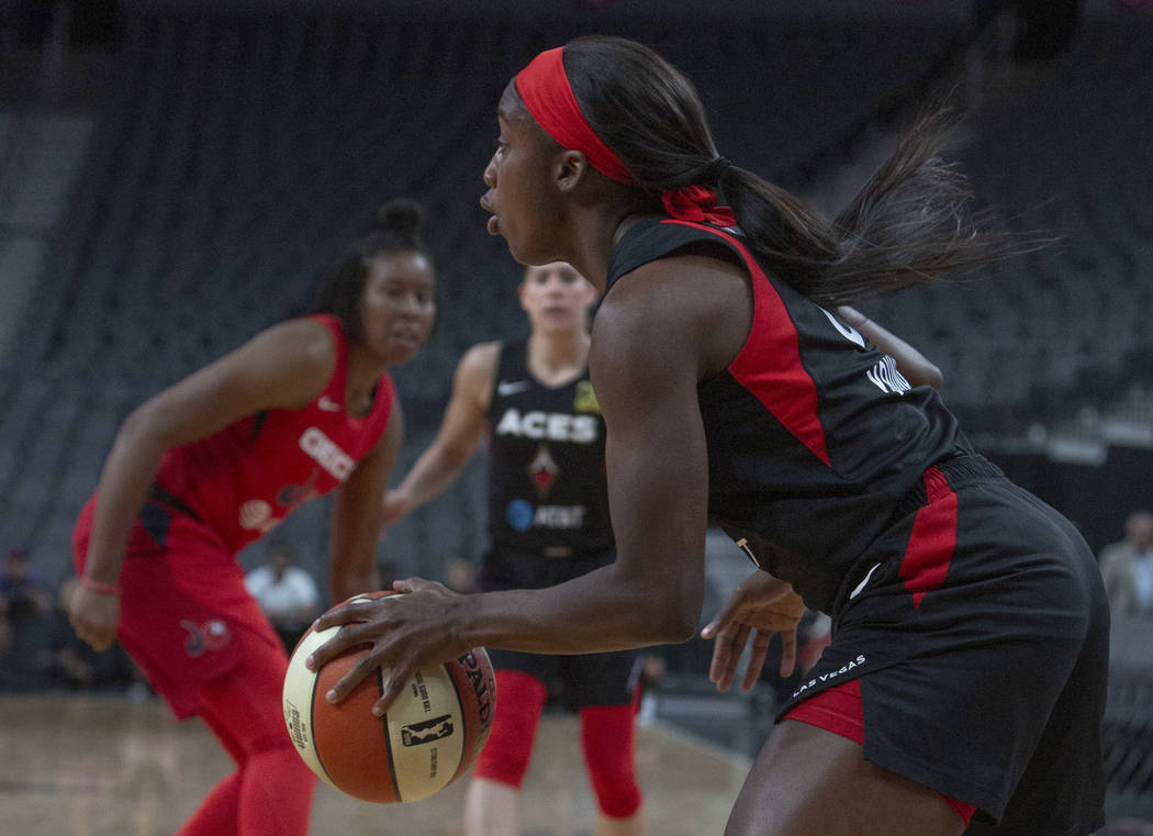 Las Vegas Aces guard Jackie Young (0) sets up a play against Washington Mystics players at T-Mo ...
