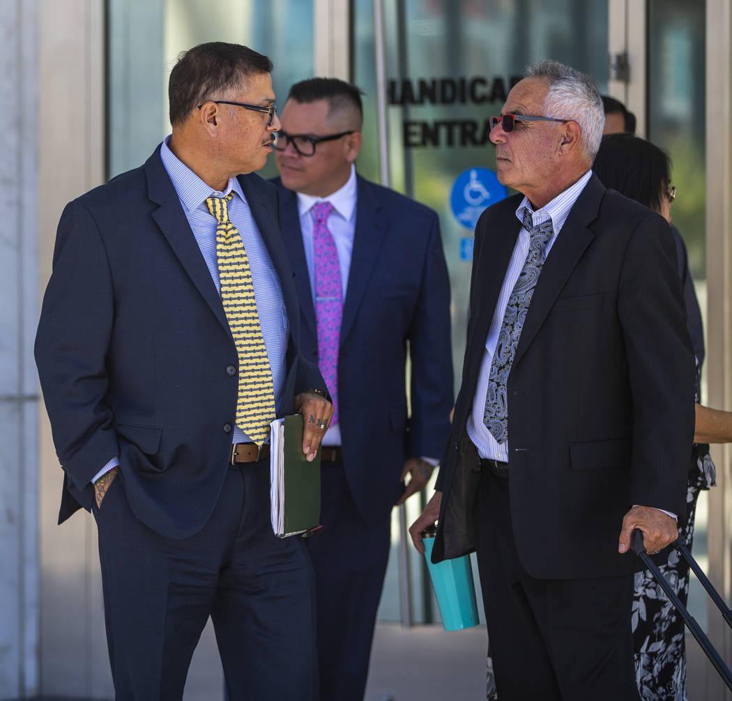 Defendants Cesar Morales, left, and Diego Garcia with counselor Shawn Perez outside the Lloyd D ...