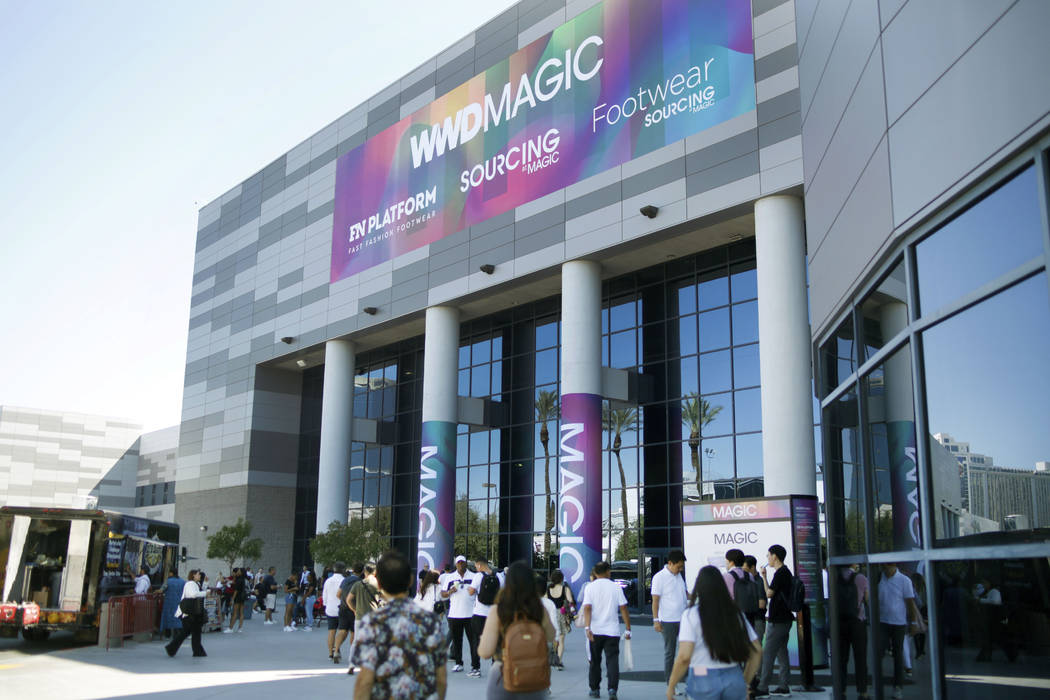 Attendees enter the show during the first day of the MAGIC trade show at the Las Vegas Conventi ...