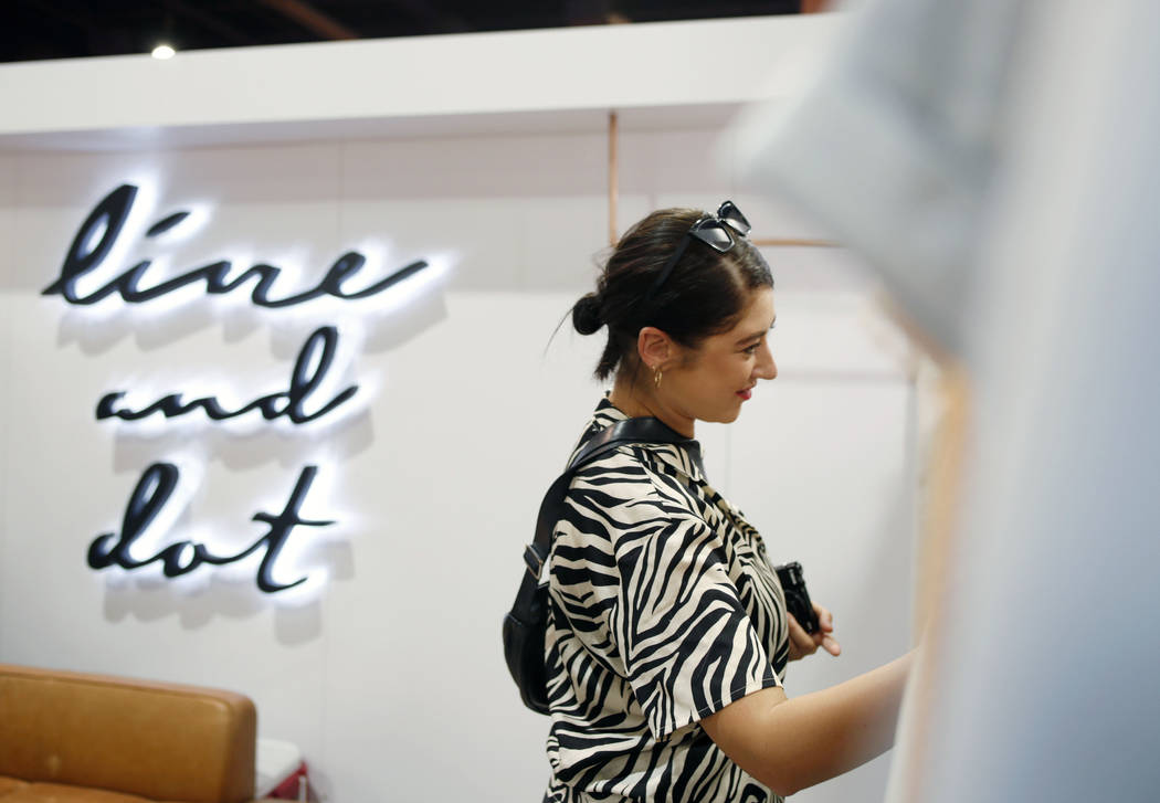 Senior youth editor for WGSN Hannah Craggs sorts through a collection from Line & Dot durin ...