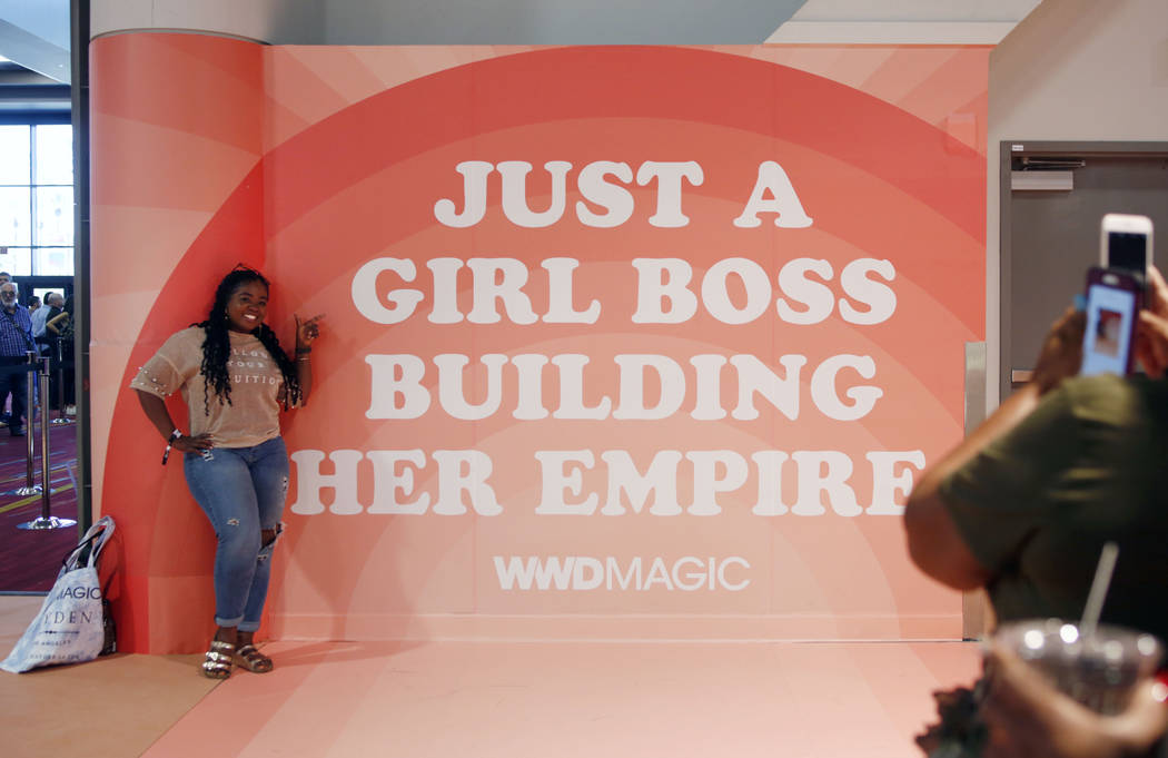 Owner of Buy Me Boutique Jessica Hall poses during the first day of the MAGIC trade show at the ...