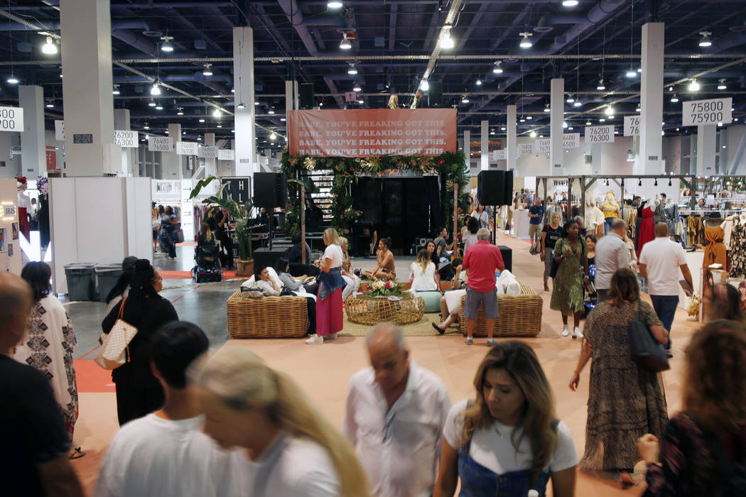 Attendees walk the show floor during the first day of the MAGIC trade show at the Las Vegas Con ...