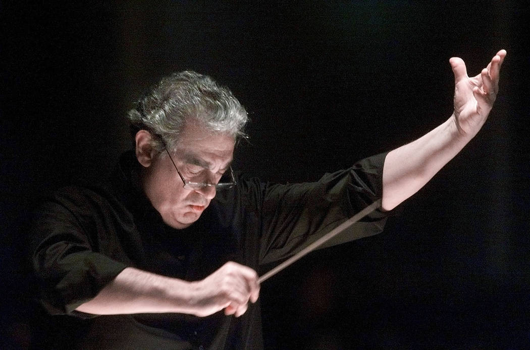 FILE - In this Saturday, Jan. 27, 2001, file photo, Placido Domingo directs the Washington Oper ...