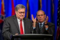 United States Attorney General William Barr, left, is applauded by F.O.P. President Chuck Cante ...