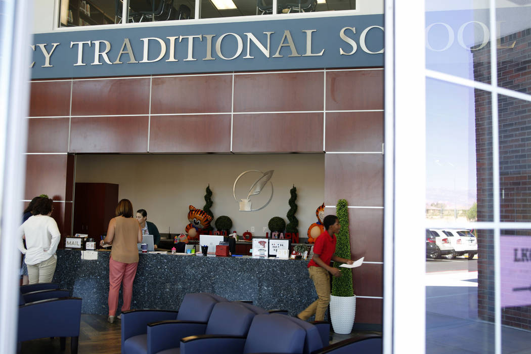 Students and faculty in the lobby of Legacy Traditional School during the opening week of the s ...