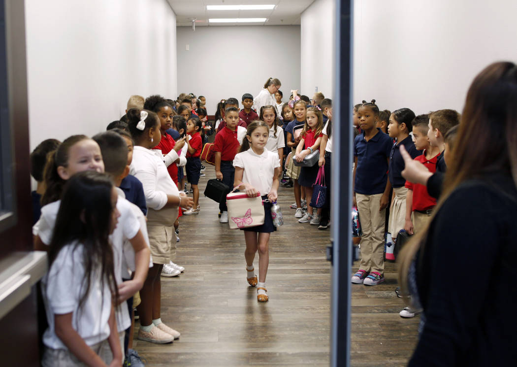 Legacy Traditional School students line up for their lunch during the opening week of the south ...