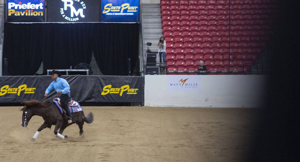 Reining expert Matt Mills practices his reining pattern at the South Point Arena in Las Vegas o ...