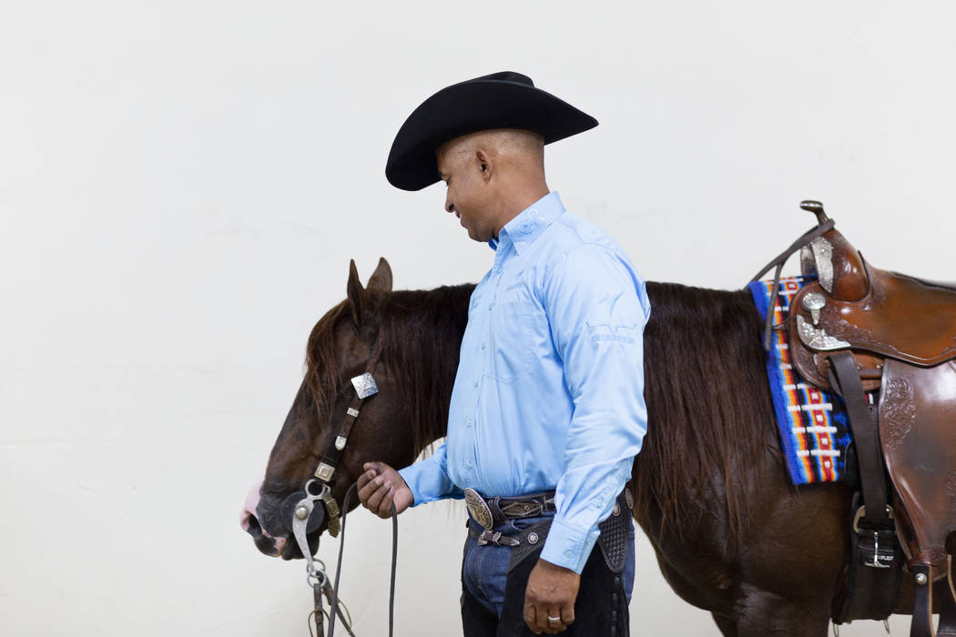 Reining expert Matt Mills finishes practicing his reining pattern at the South Point Arena in L ...