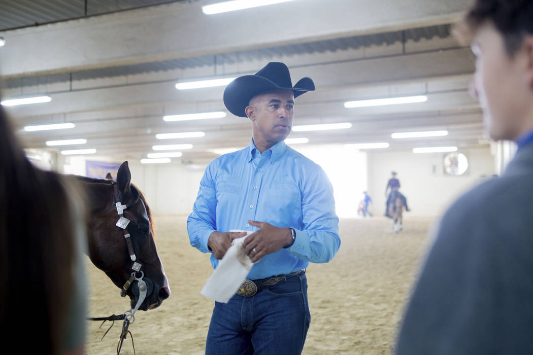Reining expert Matt Mills finishes practicing his reining pattern at the South Point Arena in L ...