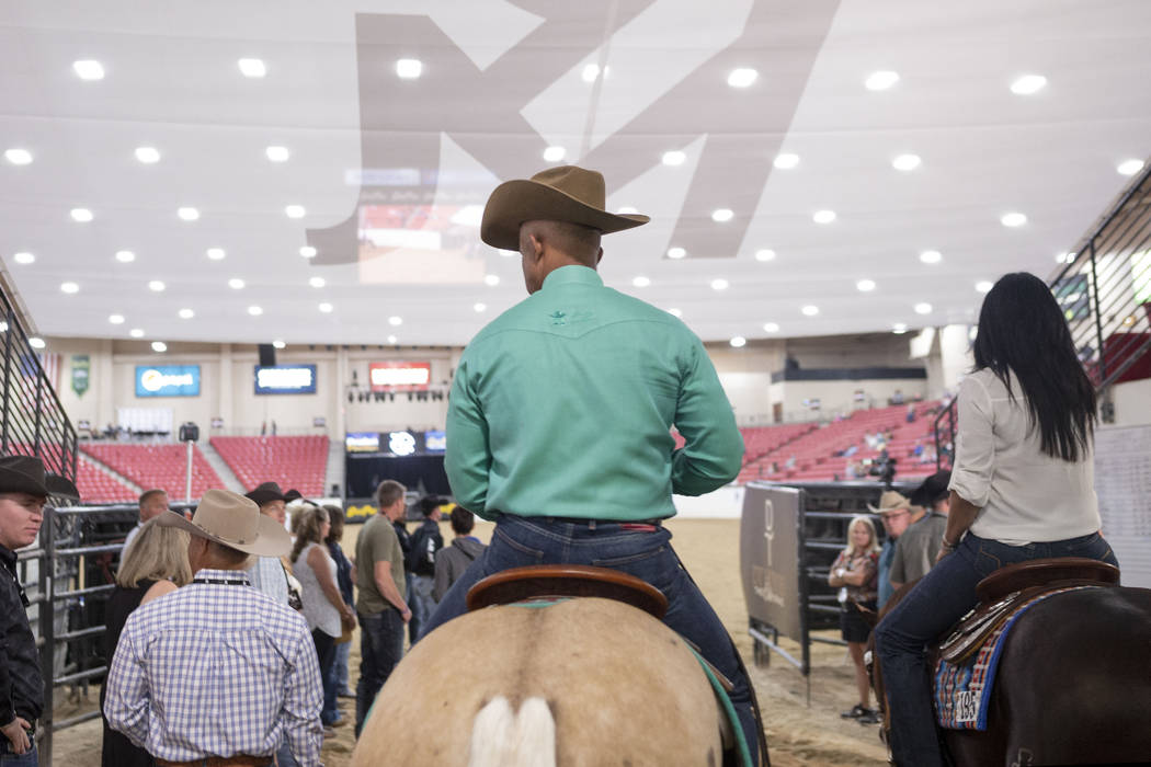 Reining expert Matt Mills, center, at the South Point Arena in Las Vegas on Friday, Aug. 16, 20 ...