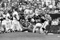 Atlanta Braves Rick Mahler, center, is dragged away by San Diego Padres Rich Gossage, right, Bo ...