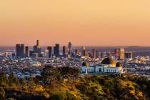 Los Angeles skyscrapers and Griffith Observatory at sunset (Getty Images)