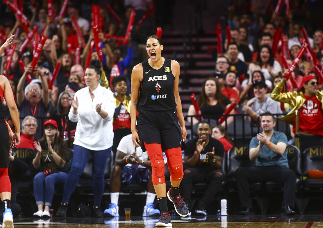 Las Vegas Aces' Liz Cambage celebrates during the second half of a WNBA basketball game against ...