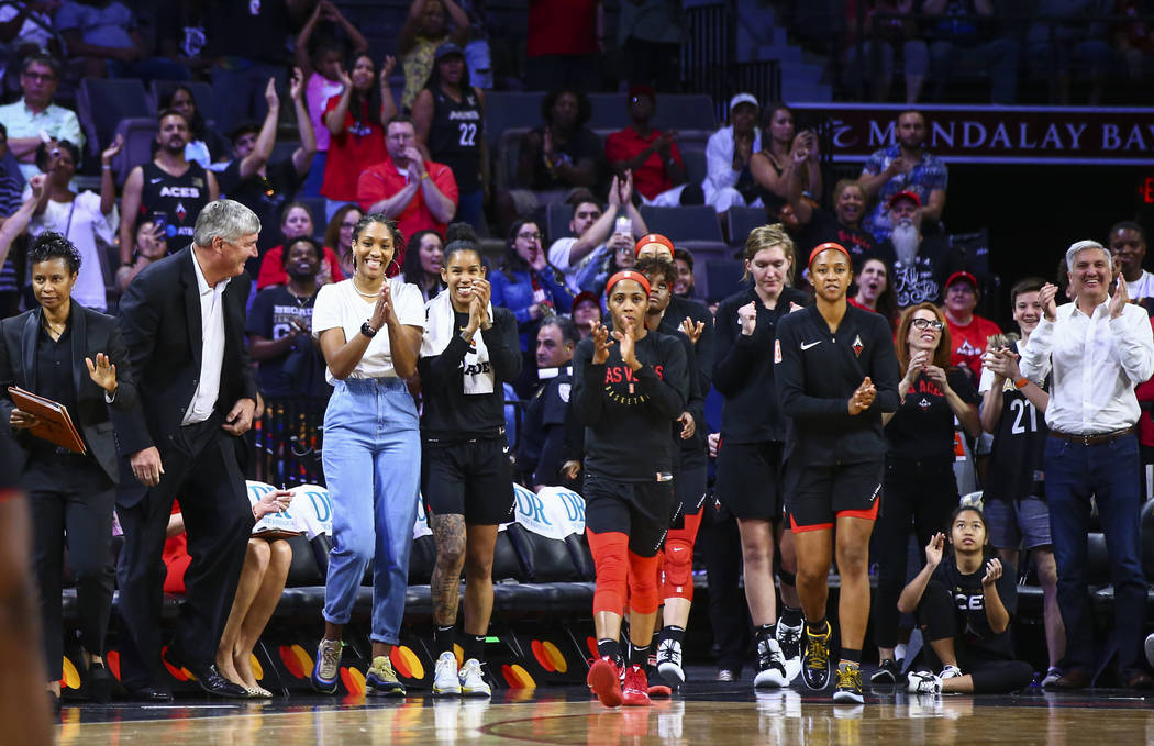 Las Vegas Aces players cheer as the team wins over the Atlanta Dream in a WNBA basketball game ...