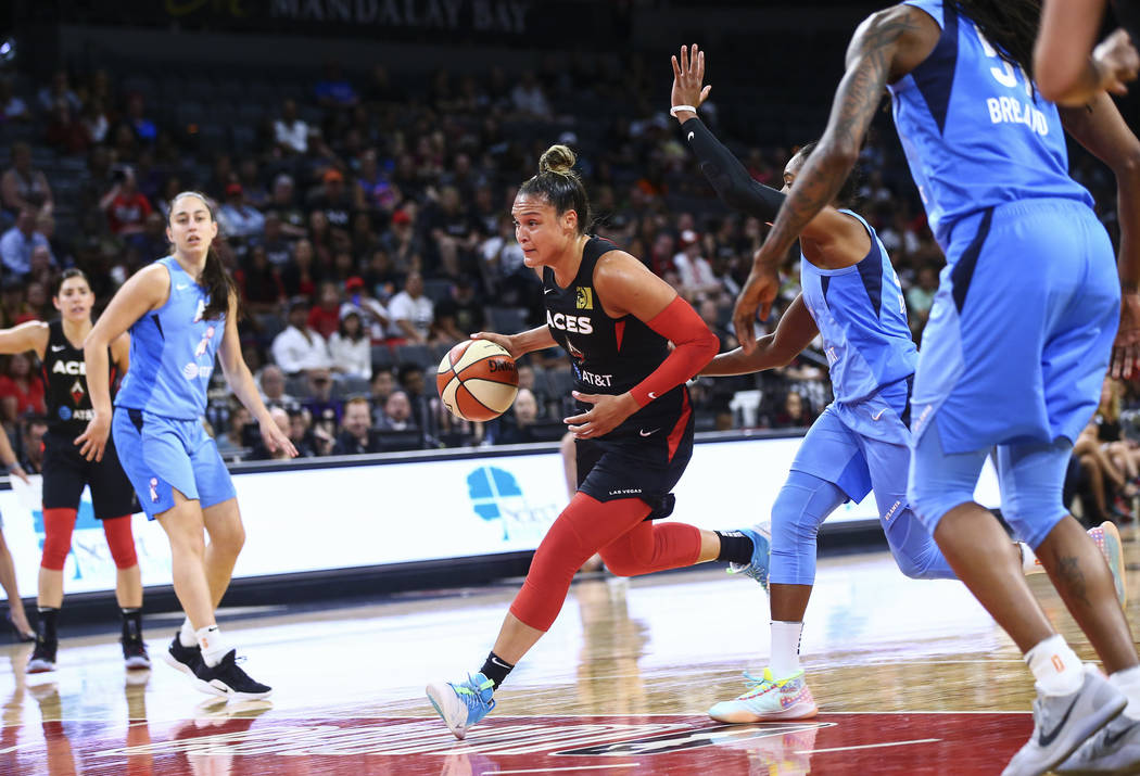 Las Vegas Aces' Kayla McBride drives to the basket past Atlanta Dream's Alex Bentley during the ...