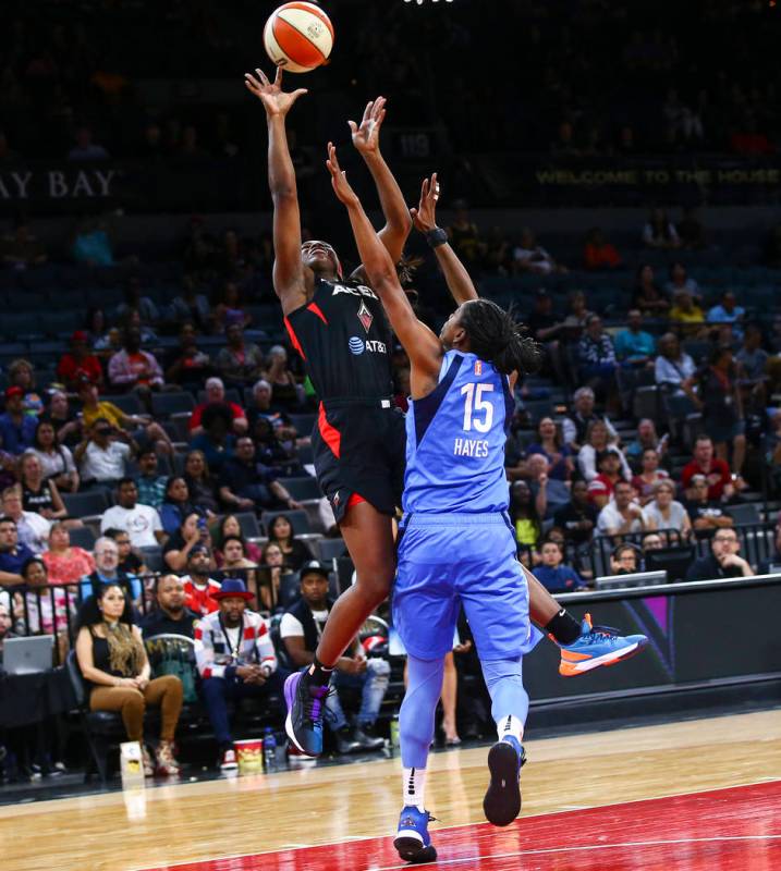 Las Vegas Aces' Jackie Young shoots against Atlanta Dream's Tiffany Hayes (15) during the secon ...