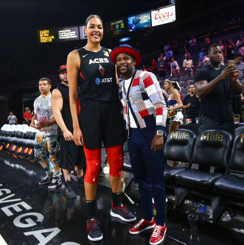 Las Vegas Aces' Liz Cambage poses with boxer Floyd Mayweather after a WNBA basketball game at t ...
