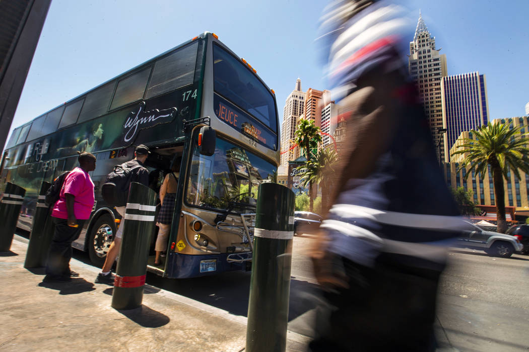 Passengers board an RTC bus north of the MGM Grand on the Strip on Tuesday, Aug. 13, 2019 in La ...
