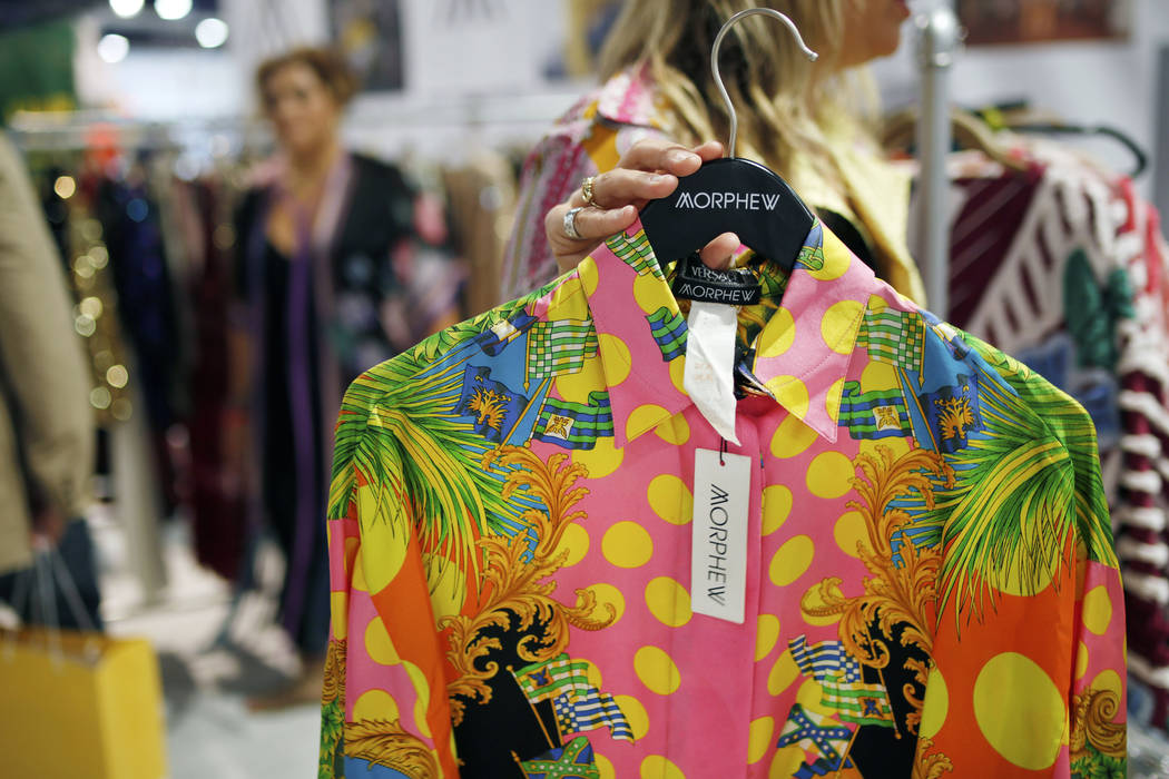 Morphew founder Bridgette Morphew holds a vintage original Versace women's blouse at the Morphe ...