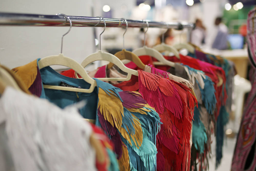 Handmade feather leather shells are displayed at the Morphew exhibit during the second day of t ...