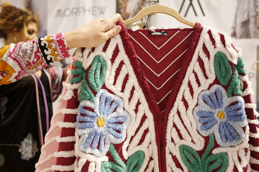 Morphew founder Bridgette Morphew holds a handmade Morphew collective 1950s chenille patchwork ...