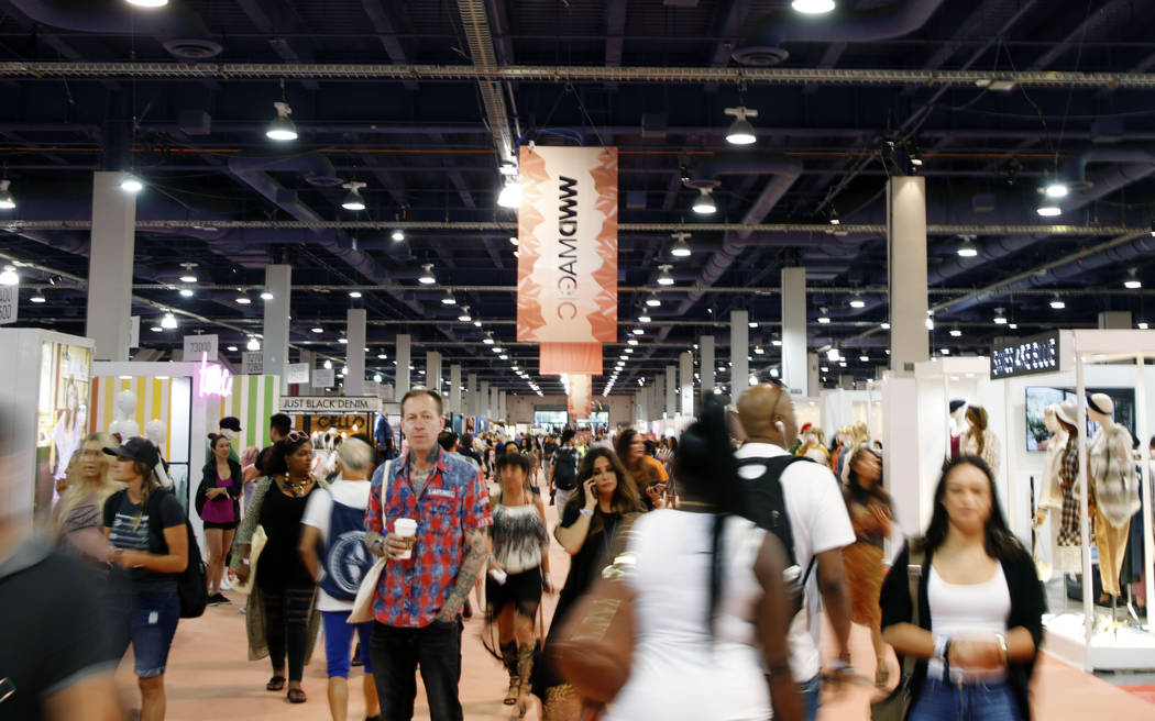 Attendees walk the show floor during the second day of the MAGIC trade show at the Las Vegas Co ...