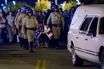 The casket of slain CHP officer Andre Moye is transported to a hearse from the Riverside Univer ...