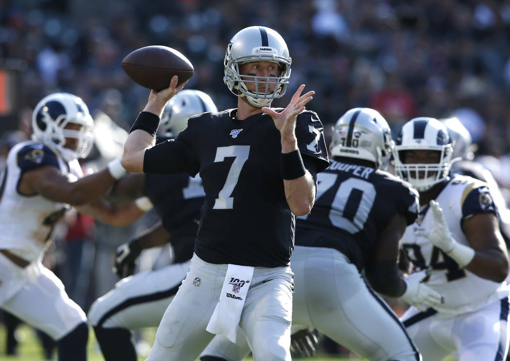 Oakland Raiders' Mike Glennon looks to pass against the Los Angeles Rams during the first half ...