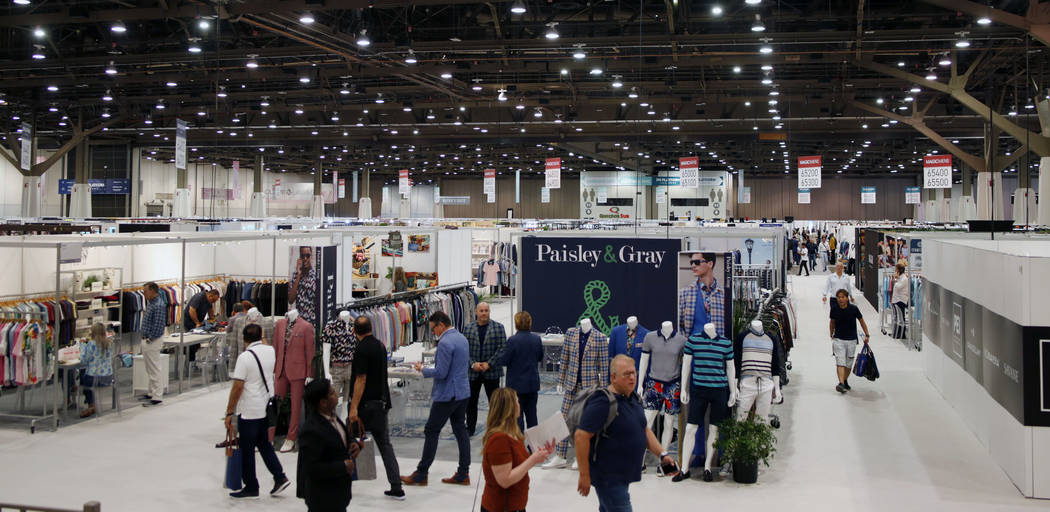 Attendees walk the Mens MAGIC floor during the third day of the MAGIC trade show at the Las Veg ...