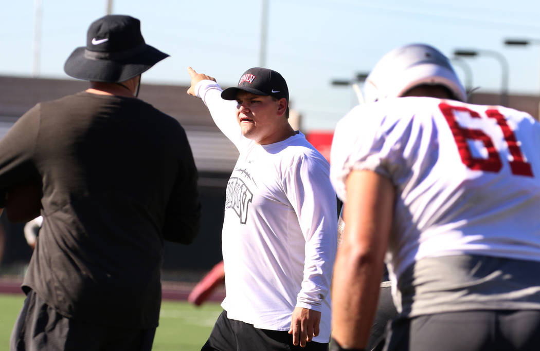 UNLV Rebels graduate assistant coach Will Kreitler instructs his players during team practice o ...