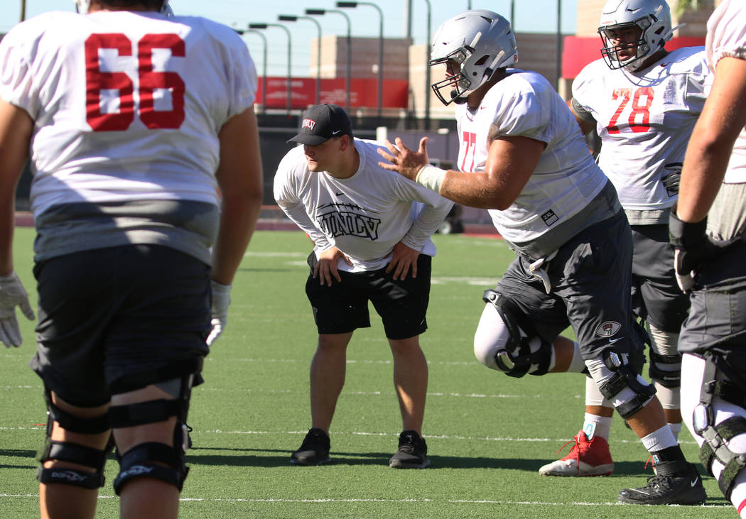 UNLV Rebels graduate assistant coach Will Kreitler watches his players during team practice on ...