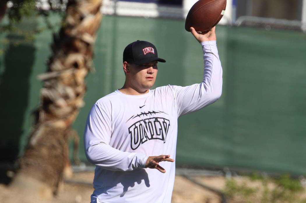 UNLV Rebels graduate assistant coach Will Kreitler prepares to pass the ball during team pract ...