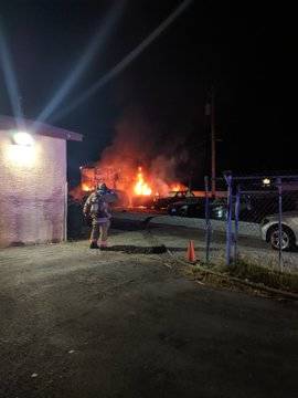 A shed and vehicles burn at B&B Auto Sales, 3800 Vegas Drive, early Thursday morning, Aug. 15, ...