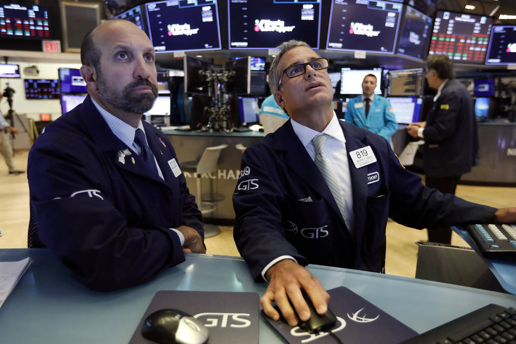 In an Aug. 13, 2019, photo specialists James Denaro, left, and Anthony Rinaldi work on the floo ...