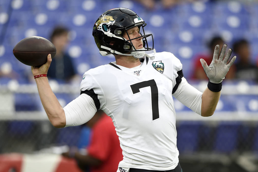 Jacksonville Jaguars quarterback Nick Foles works out prior to an NFL football preseason game a ...