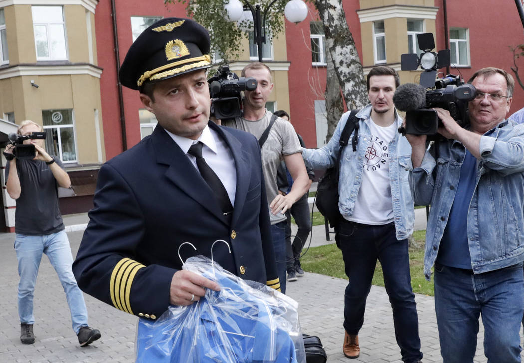 Damir Yusupov, 41, the captain of Ural Airlines A321, walks to attend a news conference in Rame ...