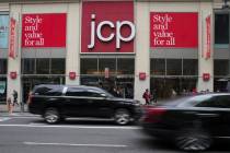 FILE - In this May 16, 2018, file photo, traffic makes its way past a logo J.C. Penney store ou ...