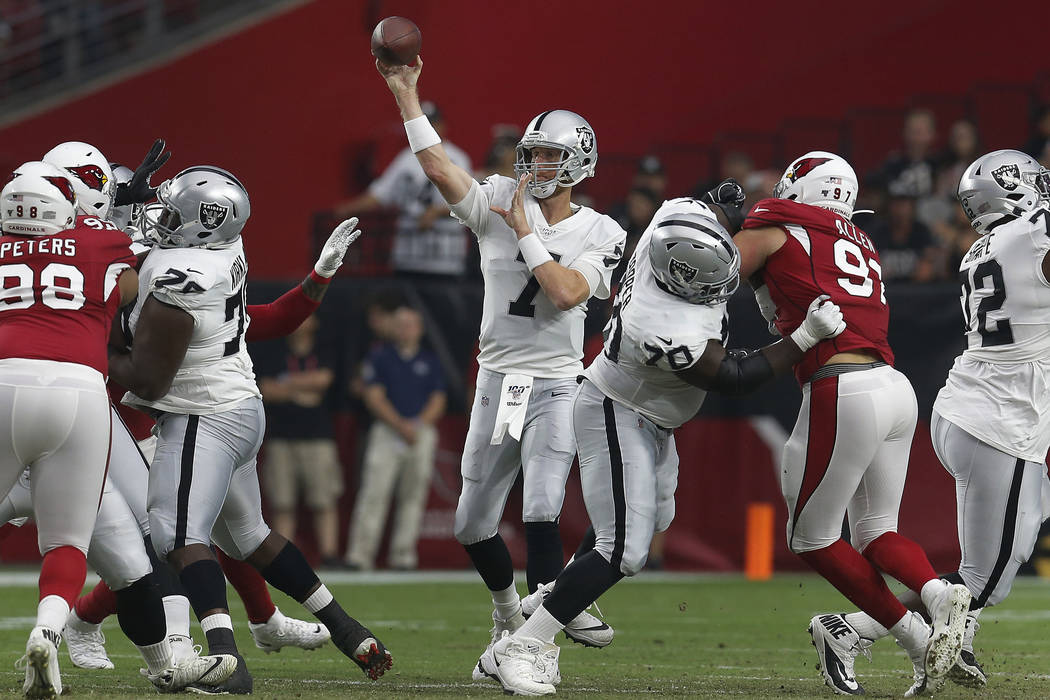Oakland Raiders quarterback Mike Glennon (7) throws against the Arizona Cardinals during the fi ...