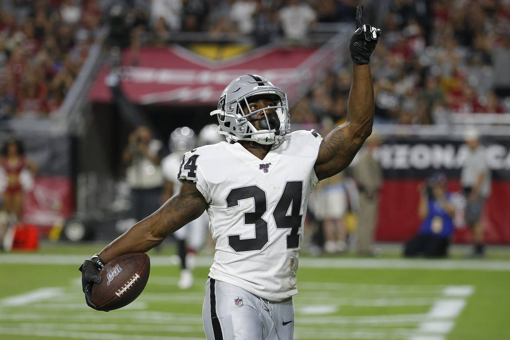 Oakland Raiders running back Mack Brown celebrates his touchdown against the Arizona Cardinals ...