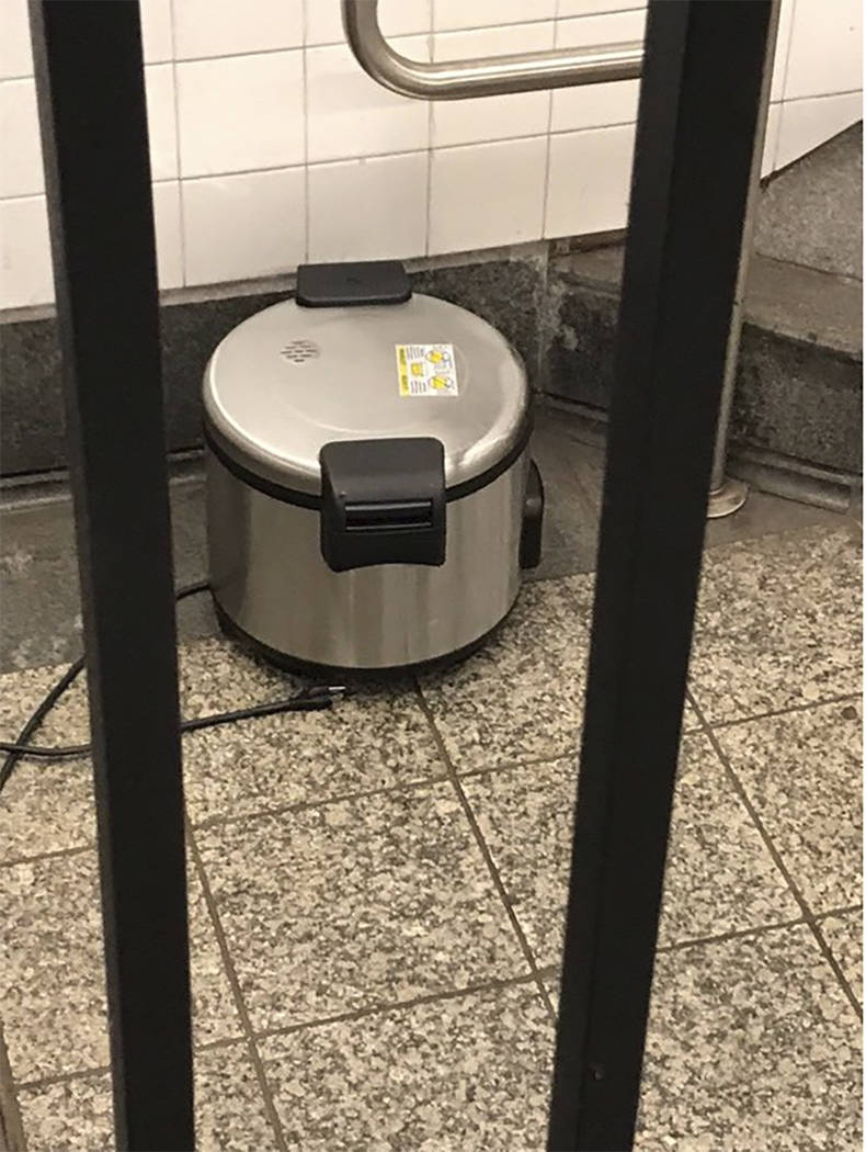 This photo provided by NYPD shows a suspicious object which looks like a pressure cooker or ele ...