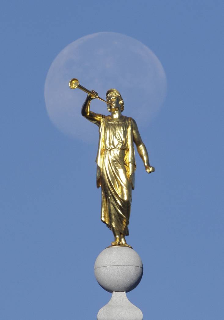 FILE - In this Sept. 11, 2014, file photo, the angel Moroni statue sits atop the Salt Lake Temp ...