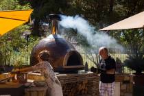 Hubert Keller, chef of Fleur de Lys and Fleur, prepares his Forno Piombo wood burning oven next ...