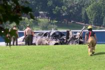 The burned remains of a plane that was carrying NASCAR television analyst and former driver Dal ...