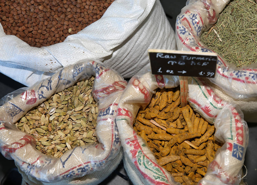 Ethiopian spices, including raw turmeric, front right, are displayed at Melkam Market, an Ethio ...
