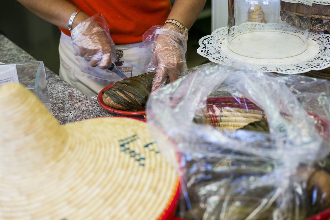 Gio Marongiu, store manager at Java Tree, prepares a dish of Ethiopian mulmul bread at Java Tr ...